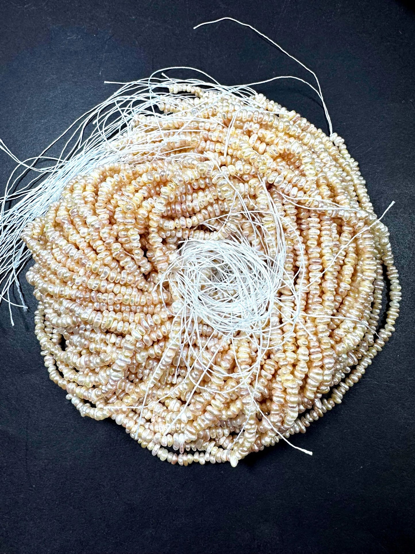 Natural fresh water pearls beads. Natural cream pink color . Excellent quality . Full strand.