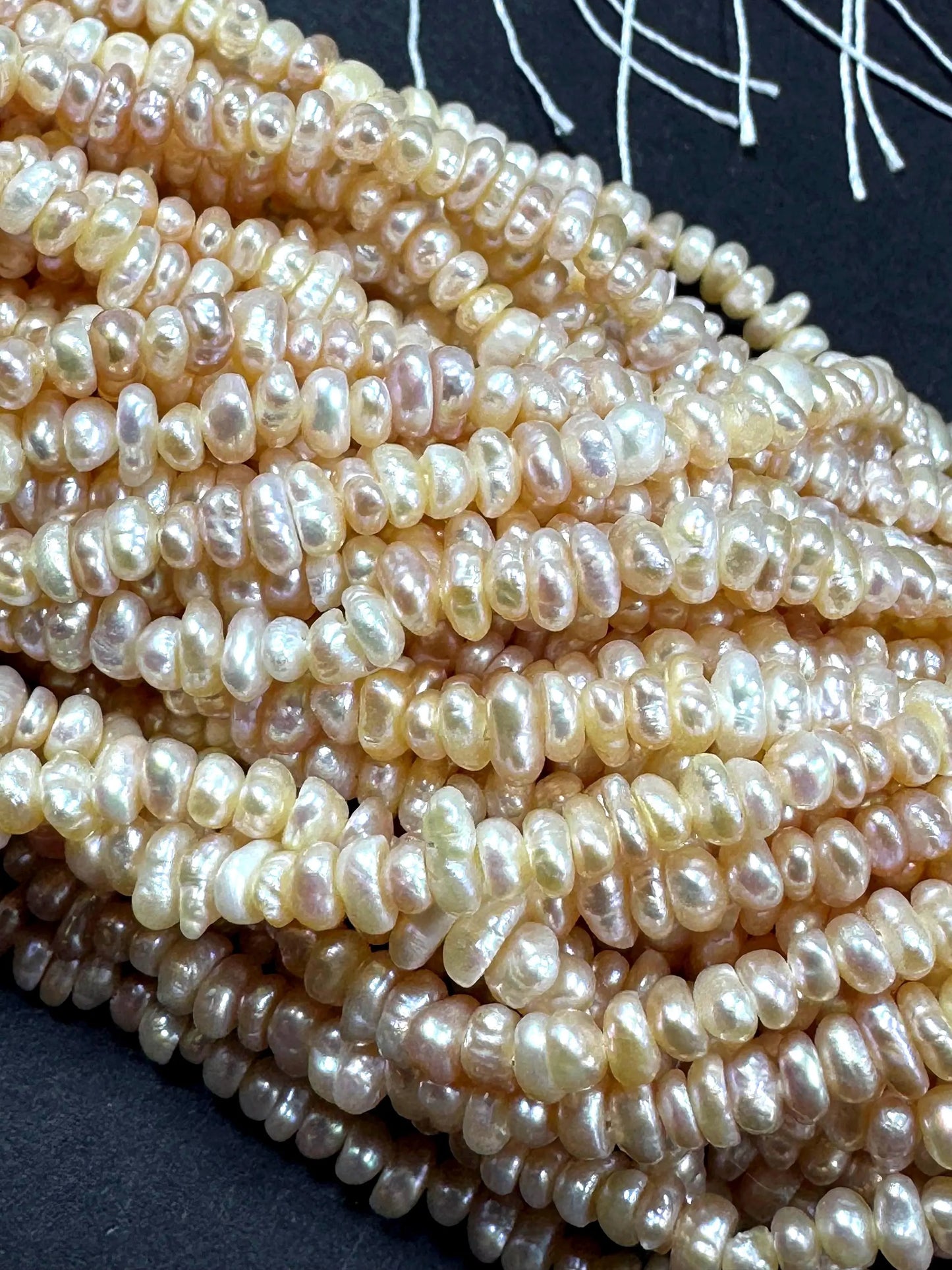 Natural fresh water pearls beads. Natural cream pink color . Excellent quality . Full strand.