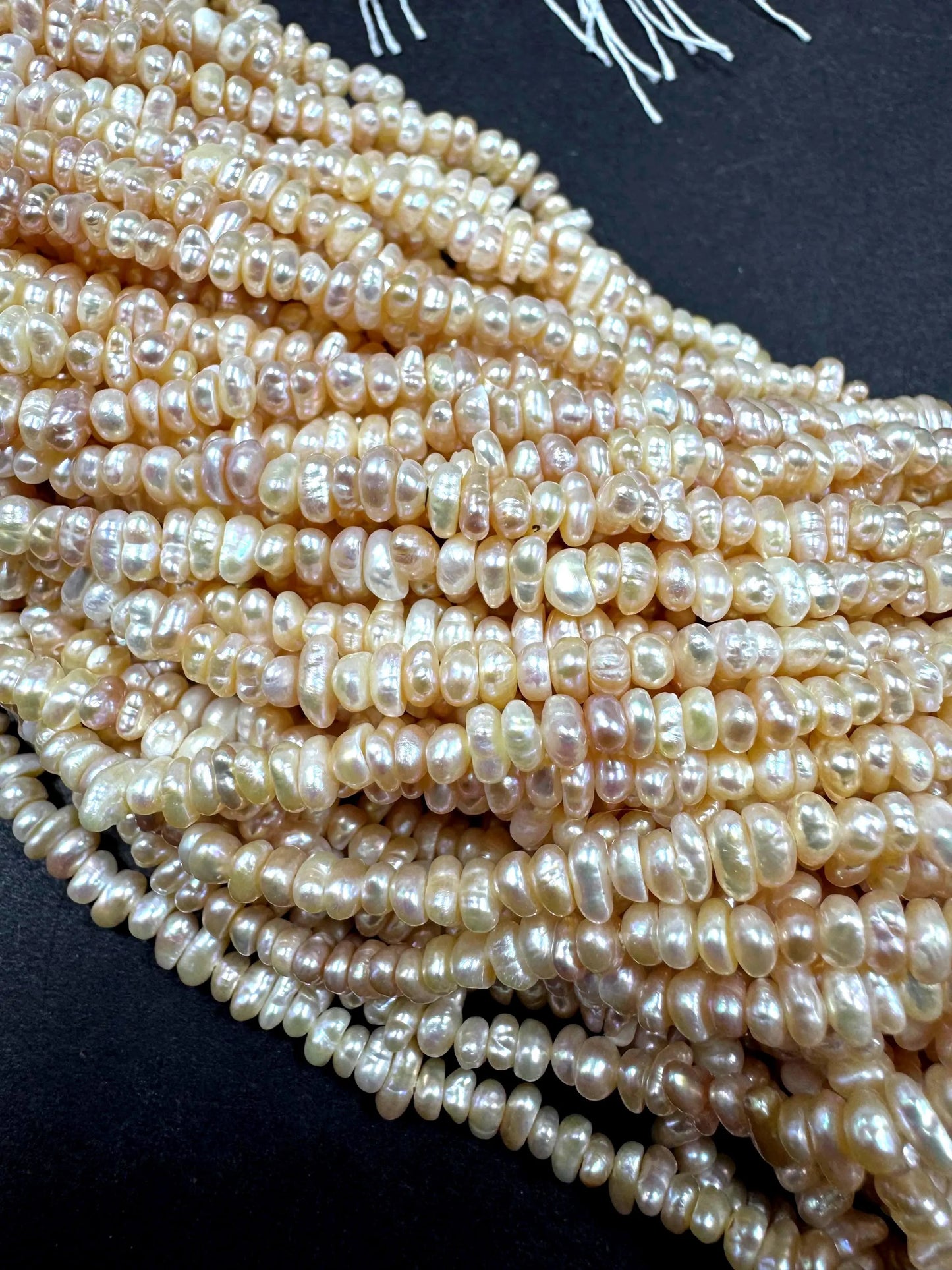 Natural fresh water pearls beads. Natural cream pink color . Excellent quality . Full strand.