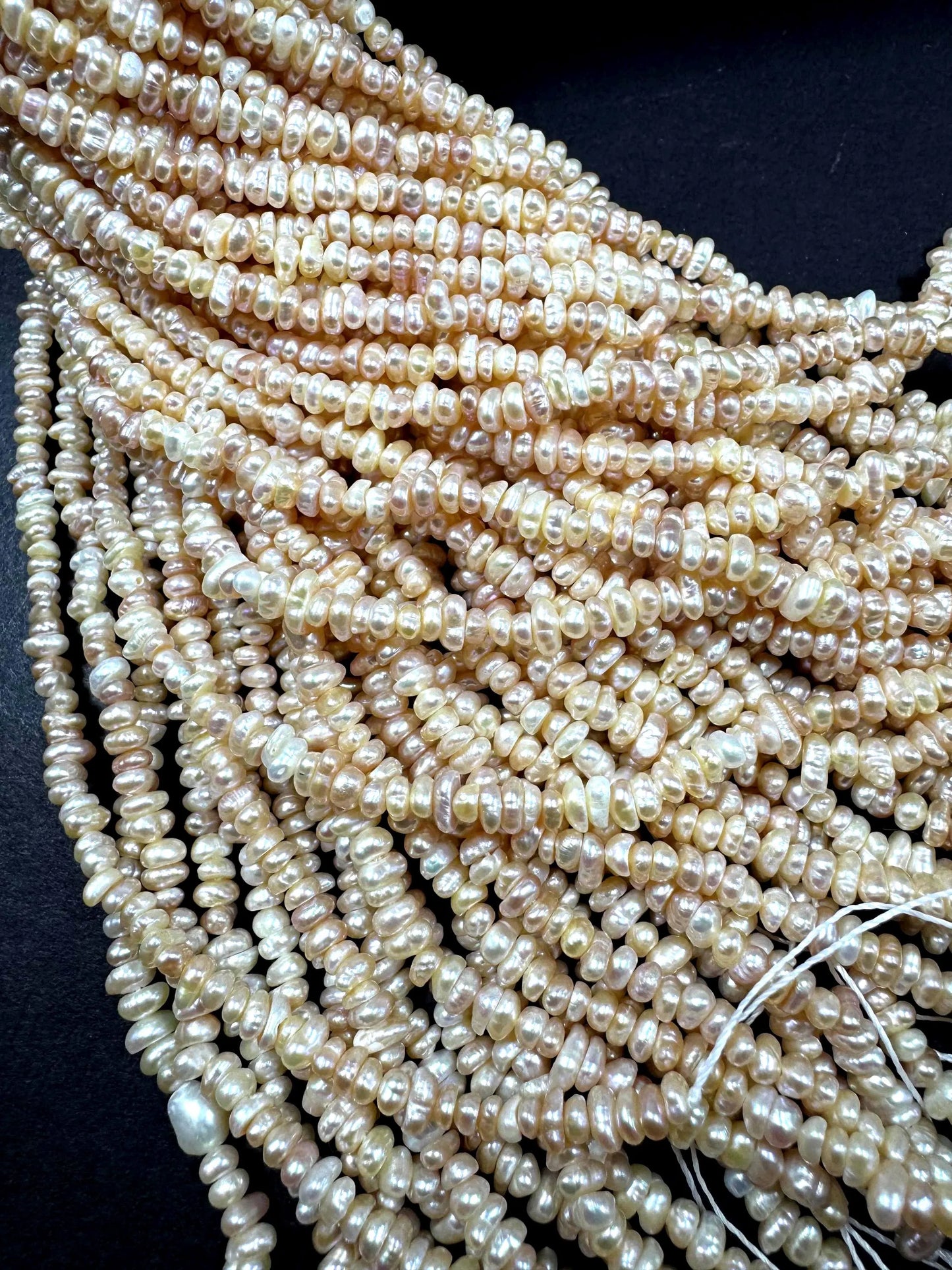 Natural fresh water pearls beads. Natural cream pink color . Excellent quality . Full strand.
