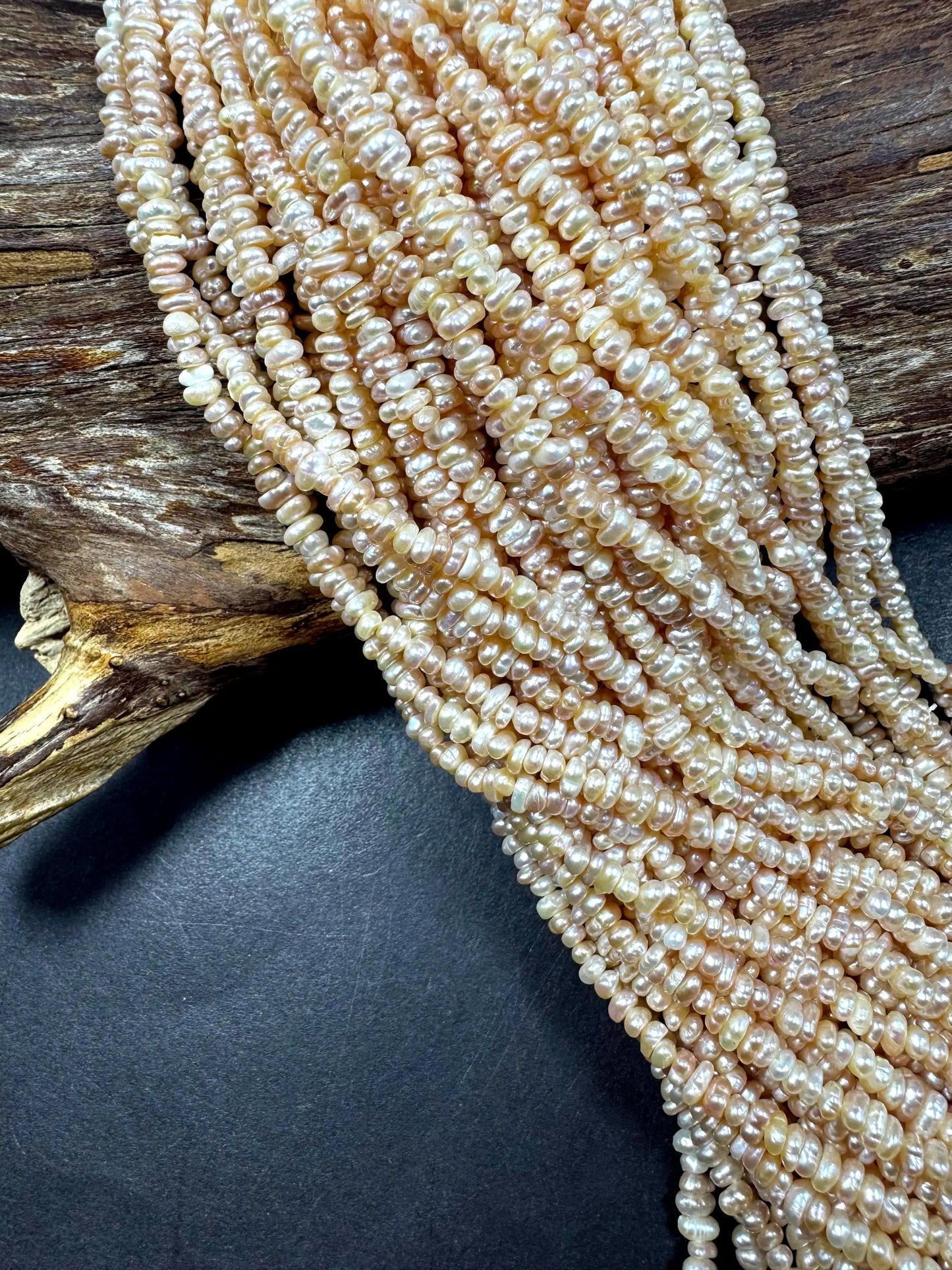 Natural fresh water pearls beads. Natural cream pink color . Excellent quality . Full strand.