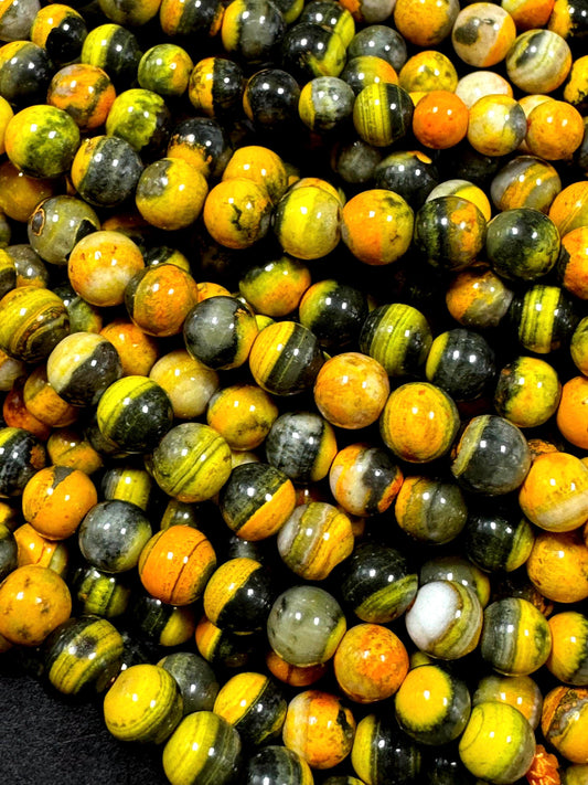Natural yellow Jasper gemstone bead. smooth round shape . gorgeous natural yellow black color Jesper bead. excellent quality.full strand 15.