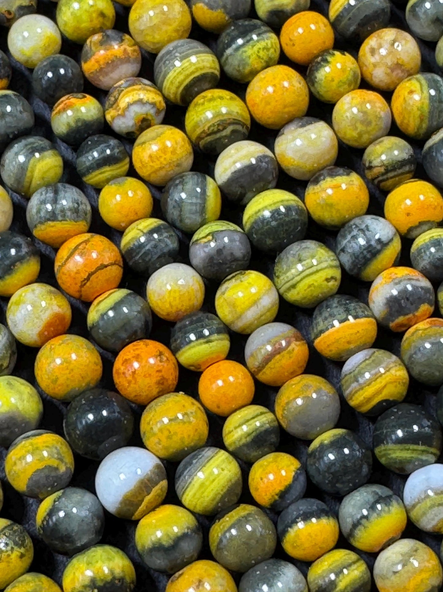 Natural yellow Jasper gemstone bead. smooth round shape . gorgeous natural yellow black color Jesper bead. excellent quality.full strand 15.