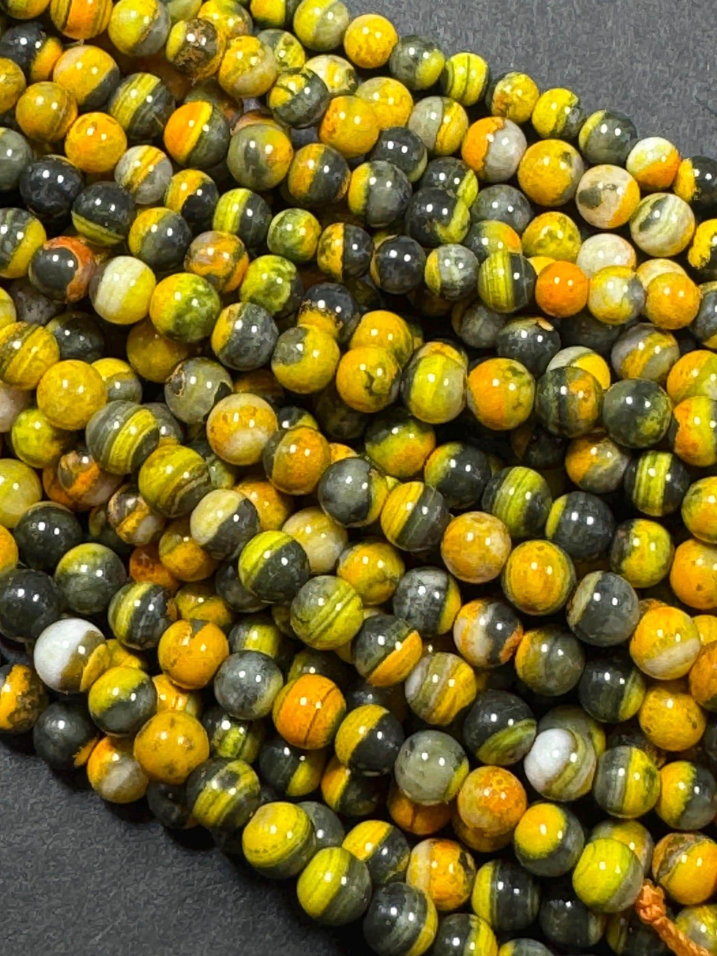 Natural yellow Jasper gemstone bead. smooth round shape . gorgeous natural yellow black color Jesper bead. excellent quality.full strand 15.