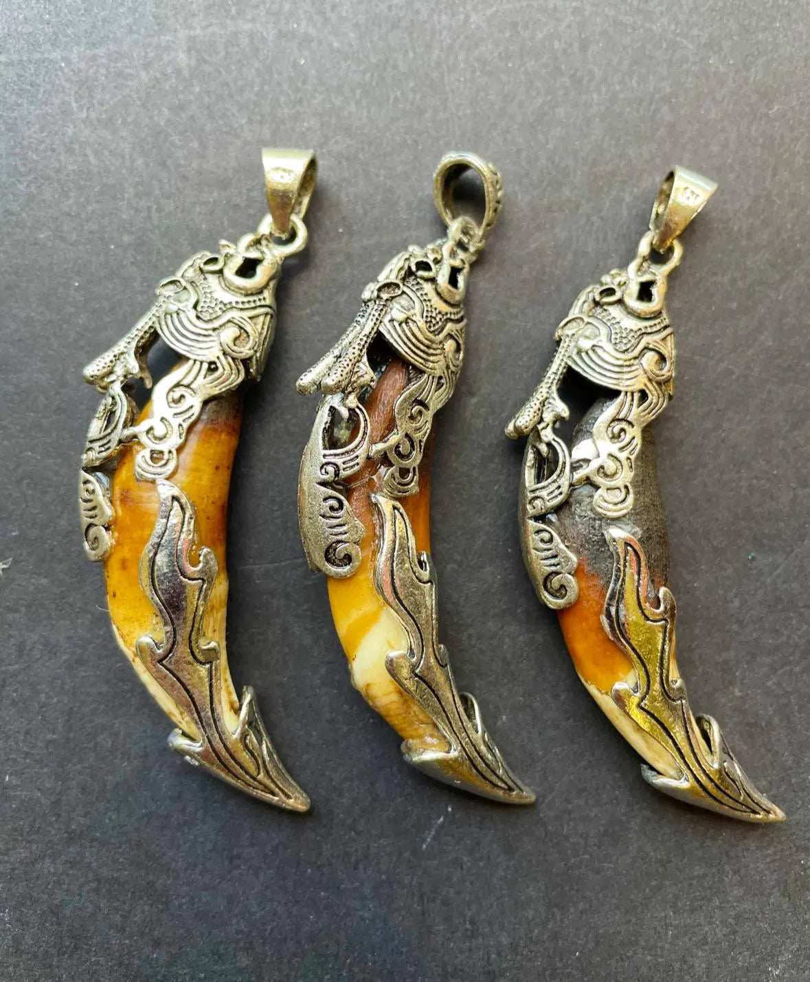 Beautiful wolf teeth pendant. 10x50mm teeth shape pendant. Gorgeous natural brown beige color teeth pendant. With silver plated pendant.