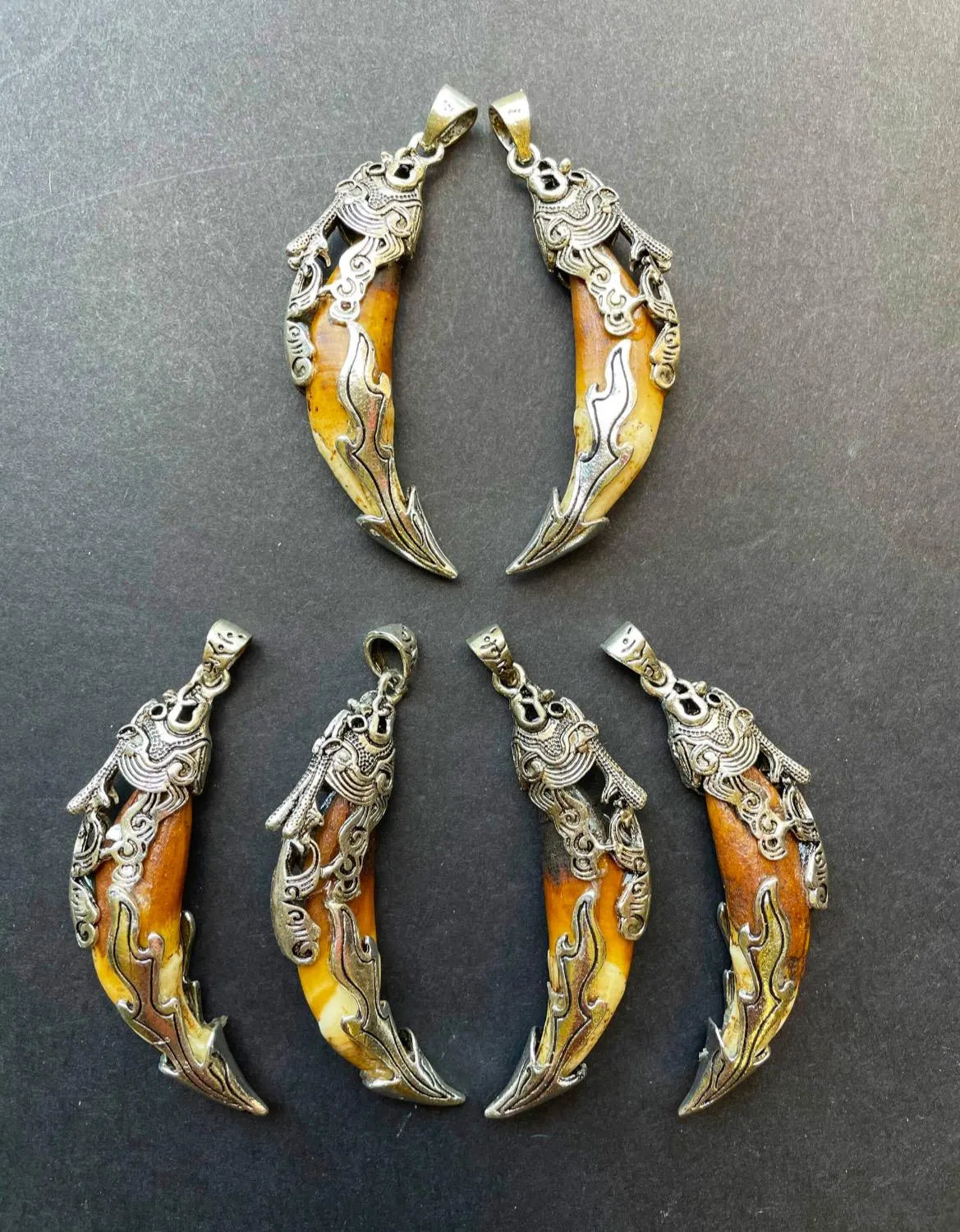 Beautiful wolf teeth pendant. 10x50mm teeth shape pendant. Gorgeous natural brown beige color teeth pendant. With silver plated pendant.