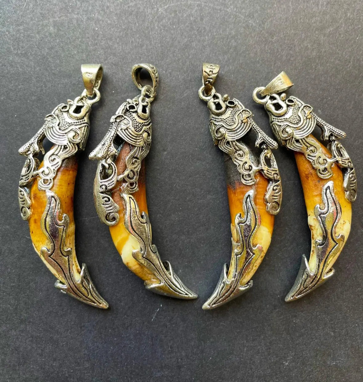 Beautiful wolf teeth pendant. 10x50mm teeth shape pendant. Gorgeous natural brown beige color teeth pendant. With silver plated pendant.