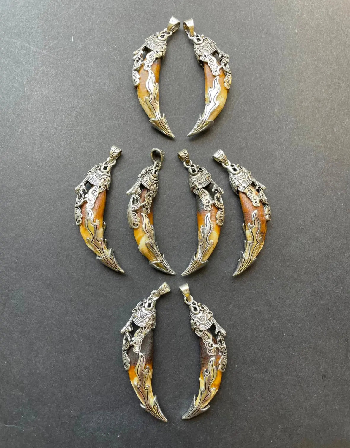 Beautiful wolf teeth pendant. 10x50mm teeth shape pendant. Gorgeous natural brown beige color teeth pendant. With silver plated pendant.