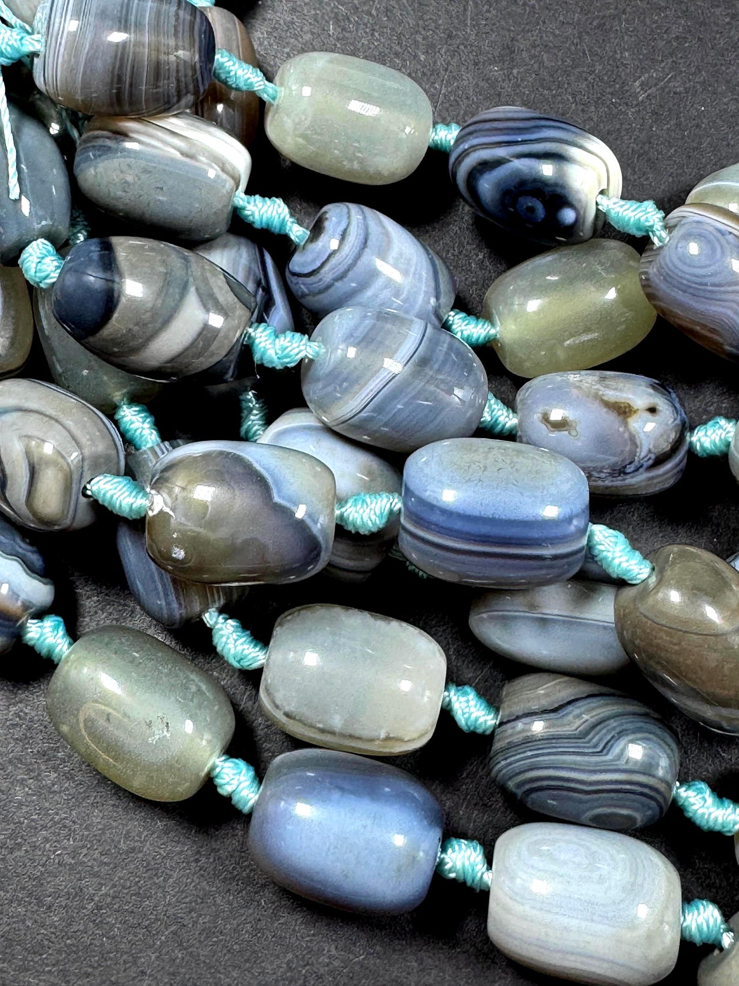 AAA Natural Botswana gemstone bead. Tuba shape. Beautiful Natural gray brown color. Not treated. Excellent quality. Full strand 15.5”