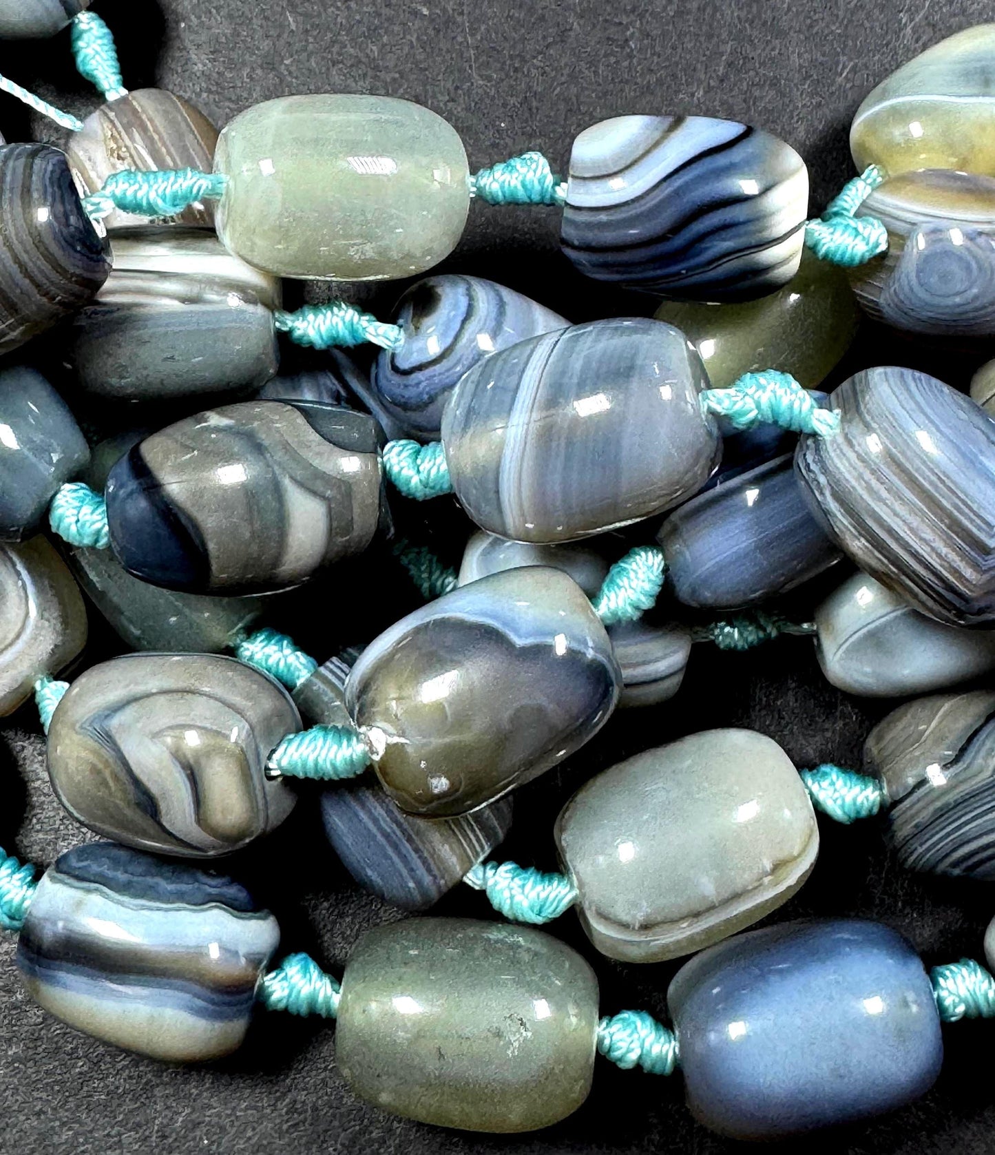 AAA Natural Botswana gemstone bead. Tuba shape. Beautiful Natural gray brown color. Not treated. Excellent quality. Full strand 15.5”