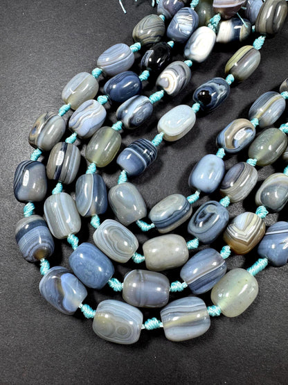 AAA Natural Botswana gemstone bead. Tuba shape. Beautiful Natural gray brown color. Not treated. Excellent quality. Full strand 15.5”