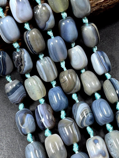 AAA Natural Botswana gemstone bead. Tuba shape. Beautiful Natural gray brown color. Not treated. Excellent quality. Full strand 15.5”