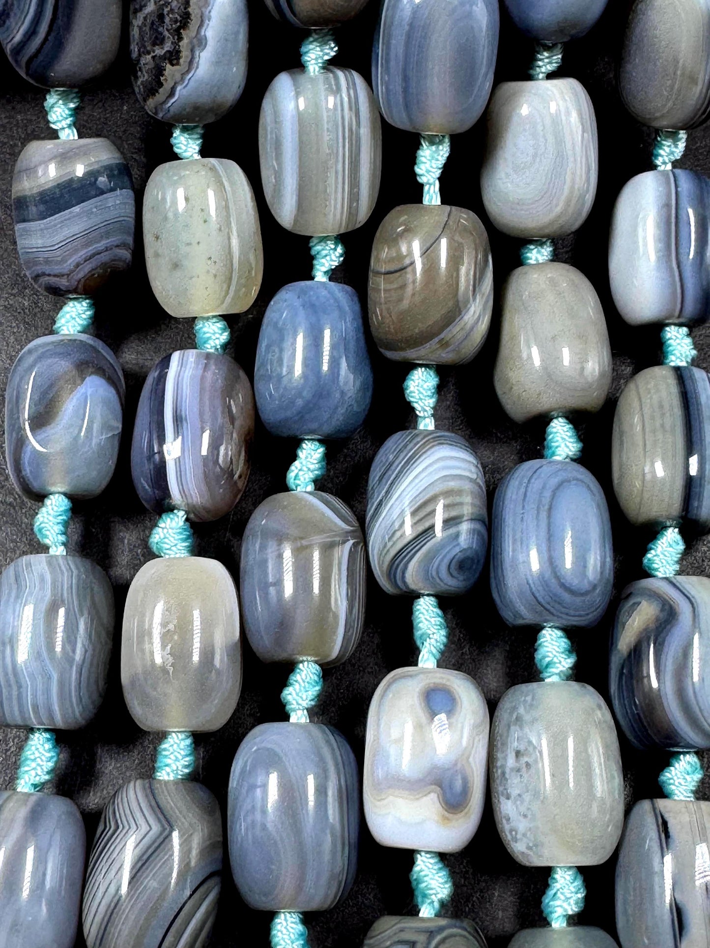 AAA Natural Botswana gemstone bead. Tuba shape. Beautiful Natural gray brown color. Not treated. Excellent quality. Full strand 15.5”