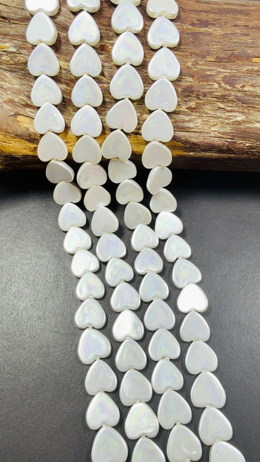 Natural Shell Pearl. Gorgeous Iridescent White color, 12mm Heart shape shell bead.Unique natural white shell bead. High quality bead!