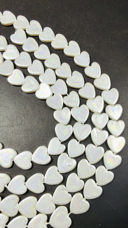 Natural Shell Pearl. Gorgeous Iridescent White color, 12mm Heart shape shell bead.Unique natural white shell bead. High quality bead!