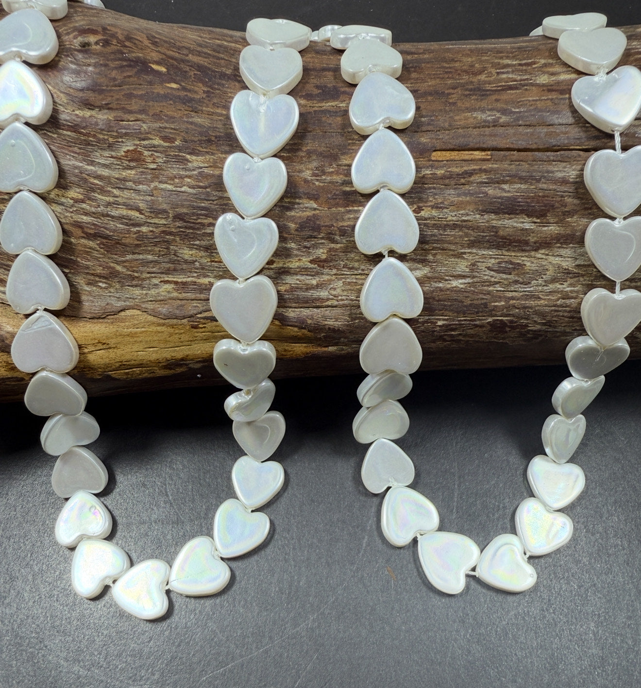 Natural Shell Pearl. Gorgeous Iridescent White color, 12mm Heart shape shell bead.Unique natural white shell bead. High quality bead!
