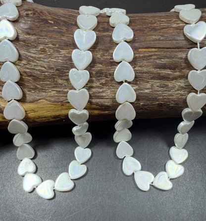 Natural Shell Pearl. Gorgeous Iridescent White color, 12mm Heart shape shell bead.Unique natural white shell bead. High quality bead!