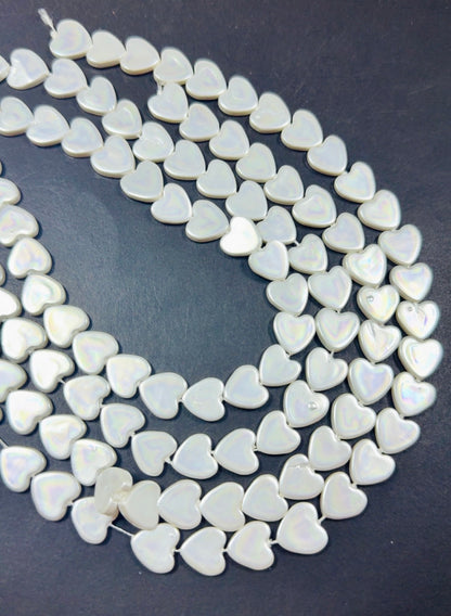 Natural Shell Pearl. Gorgeous Iridescent White color, 12mm Heart shape shell bead.Unique natural white shell bead. High quality bead!