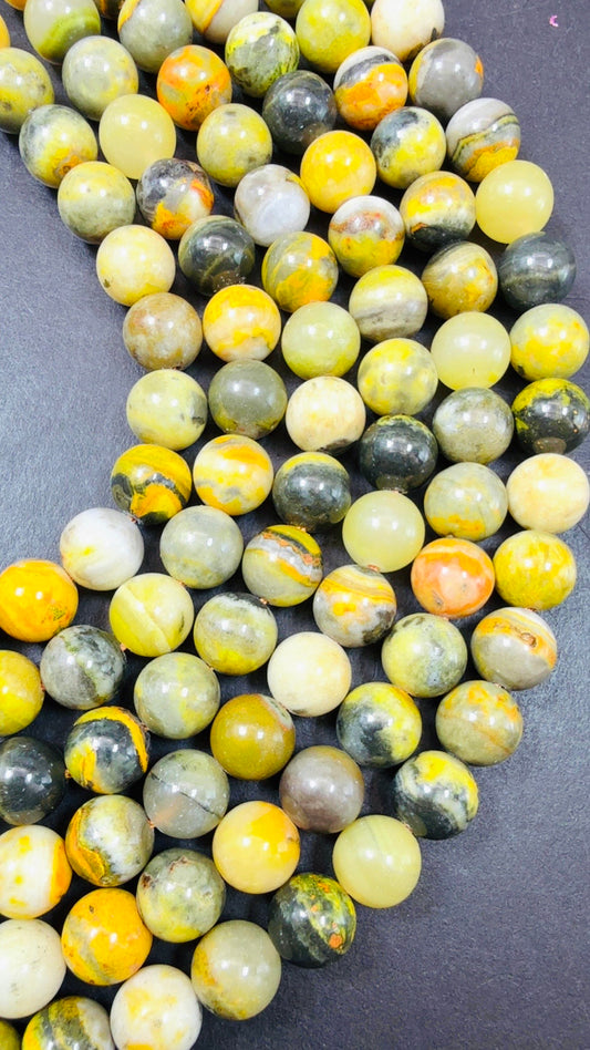 AAA Natural Eclipse stone. 6mm 8mm 10mm round bead . Beautiful natural yellow bee color with brown. High quality Eclipse stone.