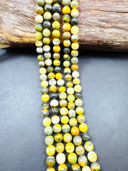 AAA Natural Eclipse stone. 6mm 8mm 10mm round bead . Beautiful natural yellow bee color with brown. High quality Eclipse stone.