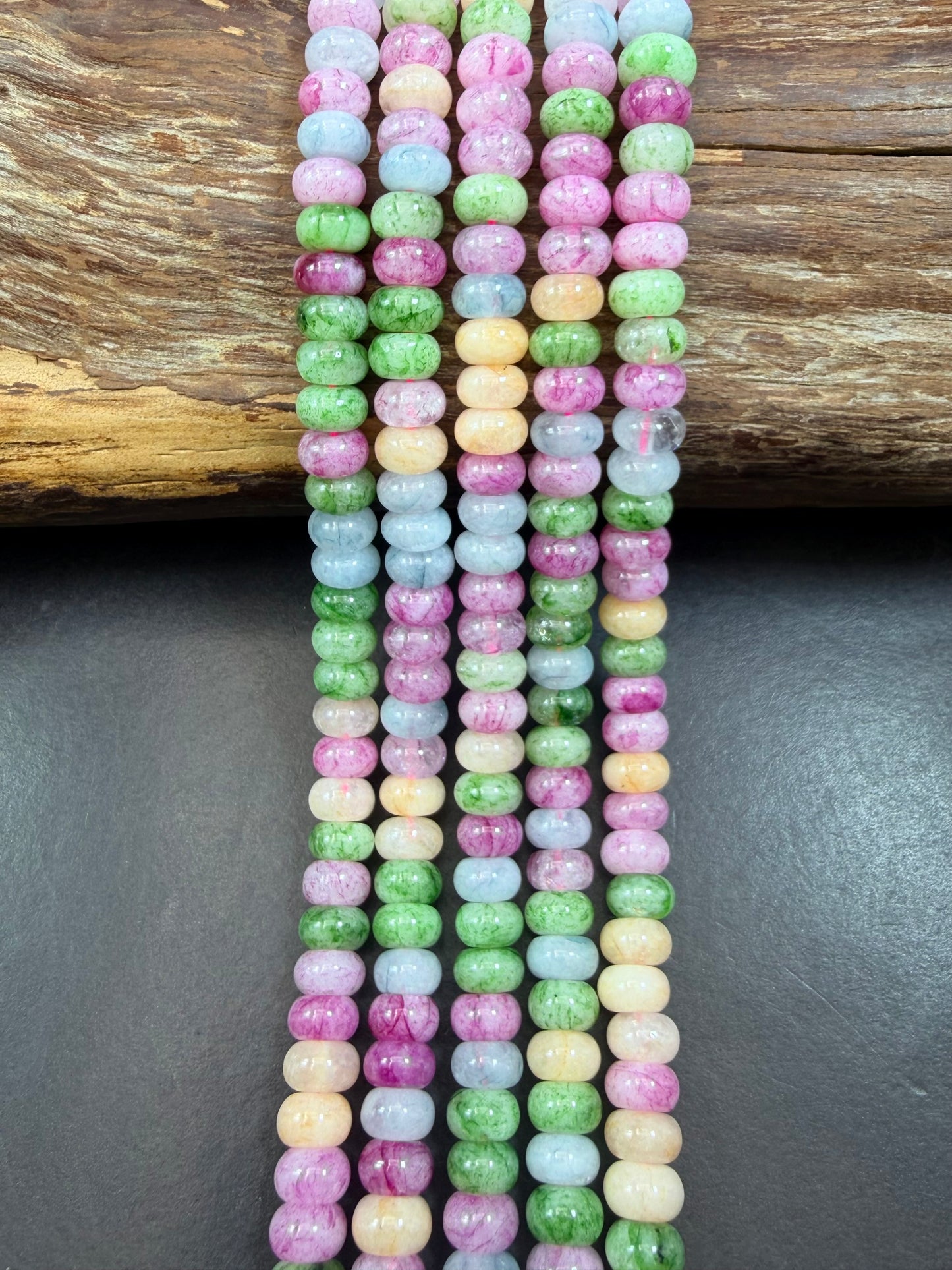 Natural gemstone bead. Multi color jade stone bead. 5x8mm smooth rondelle shape. Excellent quality. Full strand 15.5”.