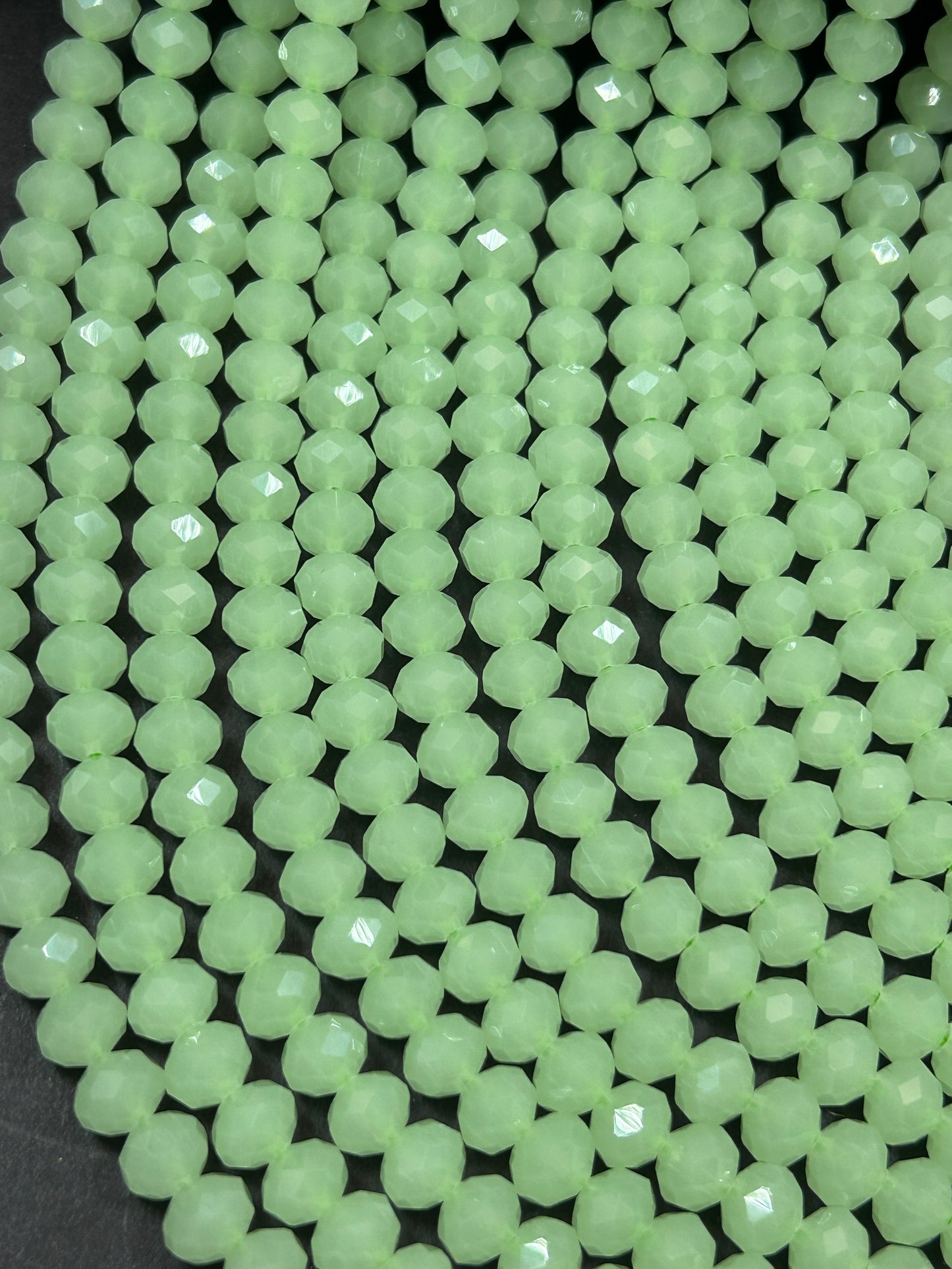 Beautiful Chinese crystal. Faceted Rondelle shape bead. Gorgeous spring green iridescent rainbow color. Great quality glass full strand