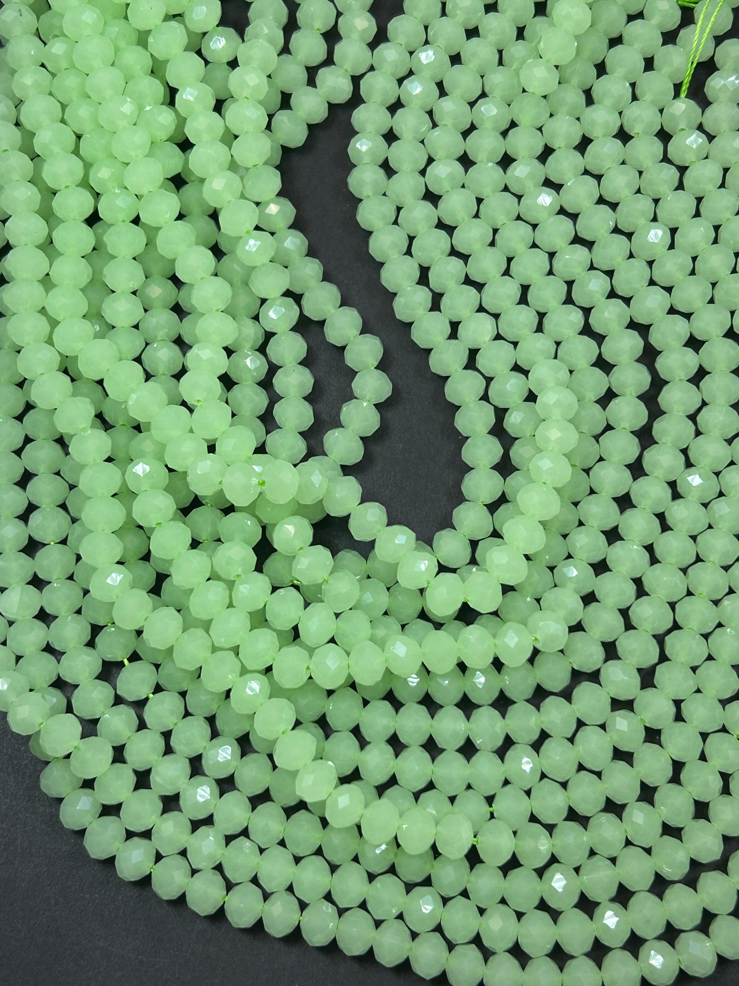 Beautiful Chinese crystal. Faceted Rondelle shape bead. Gorgeous spring green iridescent rainbow color. Great quality glass full strand