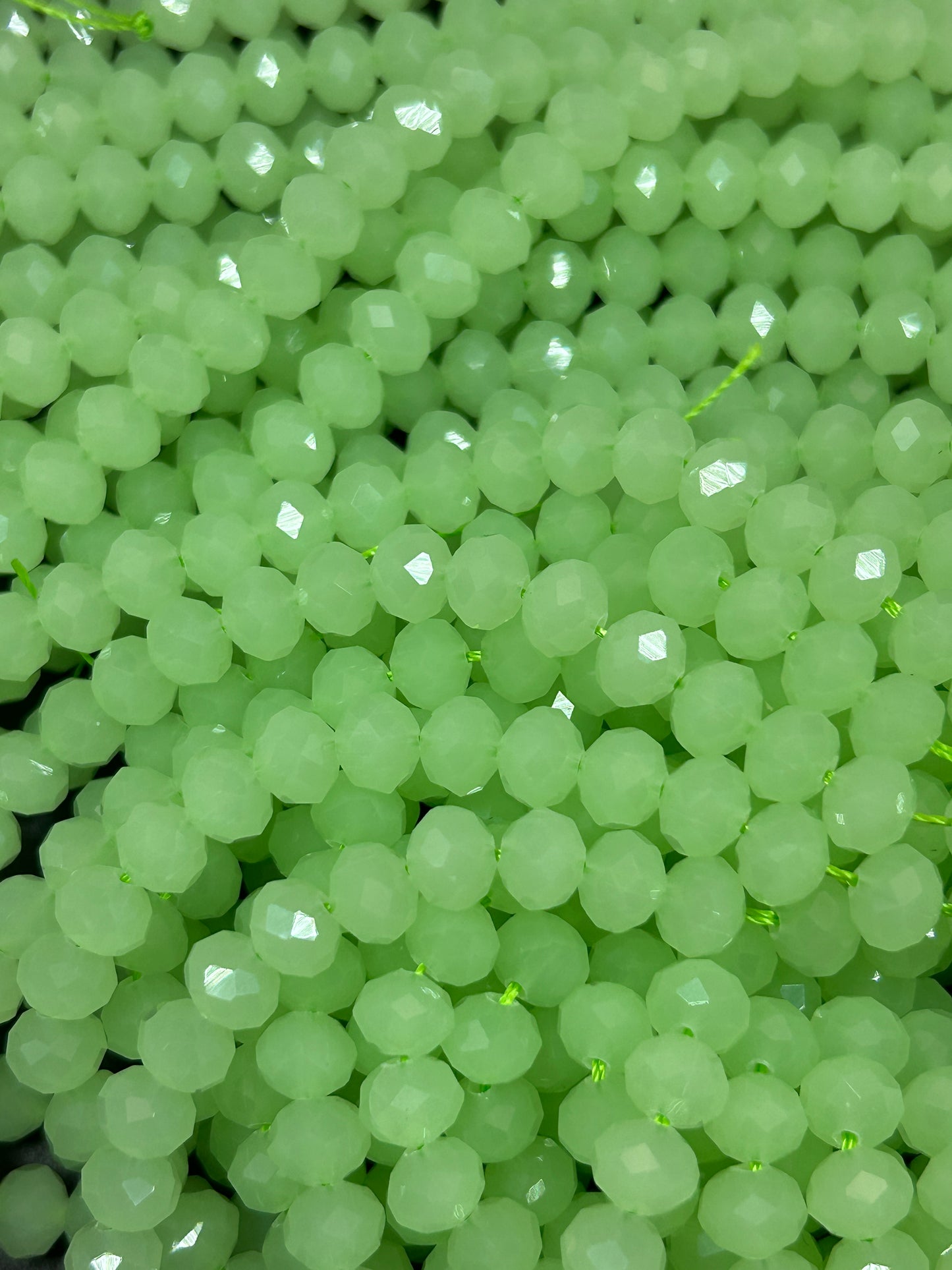 Beautiful Chinese crystal. Faceted Rondelle shape bead. Gorgeous spring green iridescent rainbow color. Great quality glass full strand