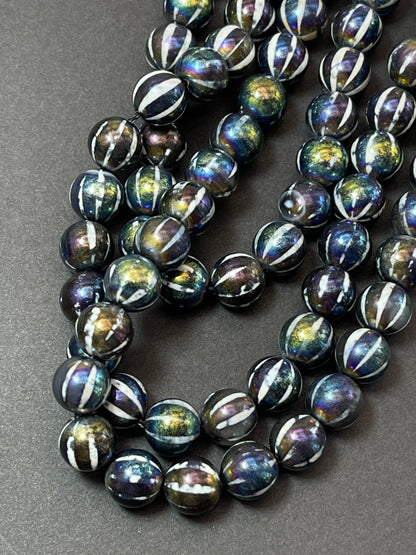 Mystic hand painted Tibetan Onyx 8mm 10mm round bead. Beautiful black rainbow hand painted design. Unique looking gemstone. Full strand 15"