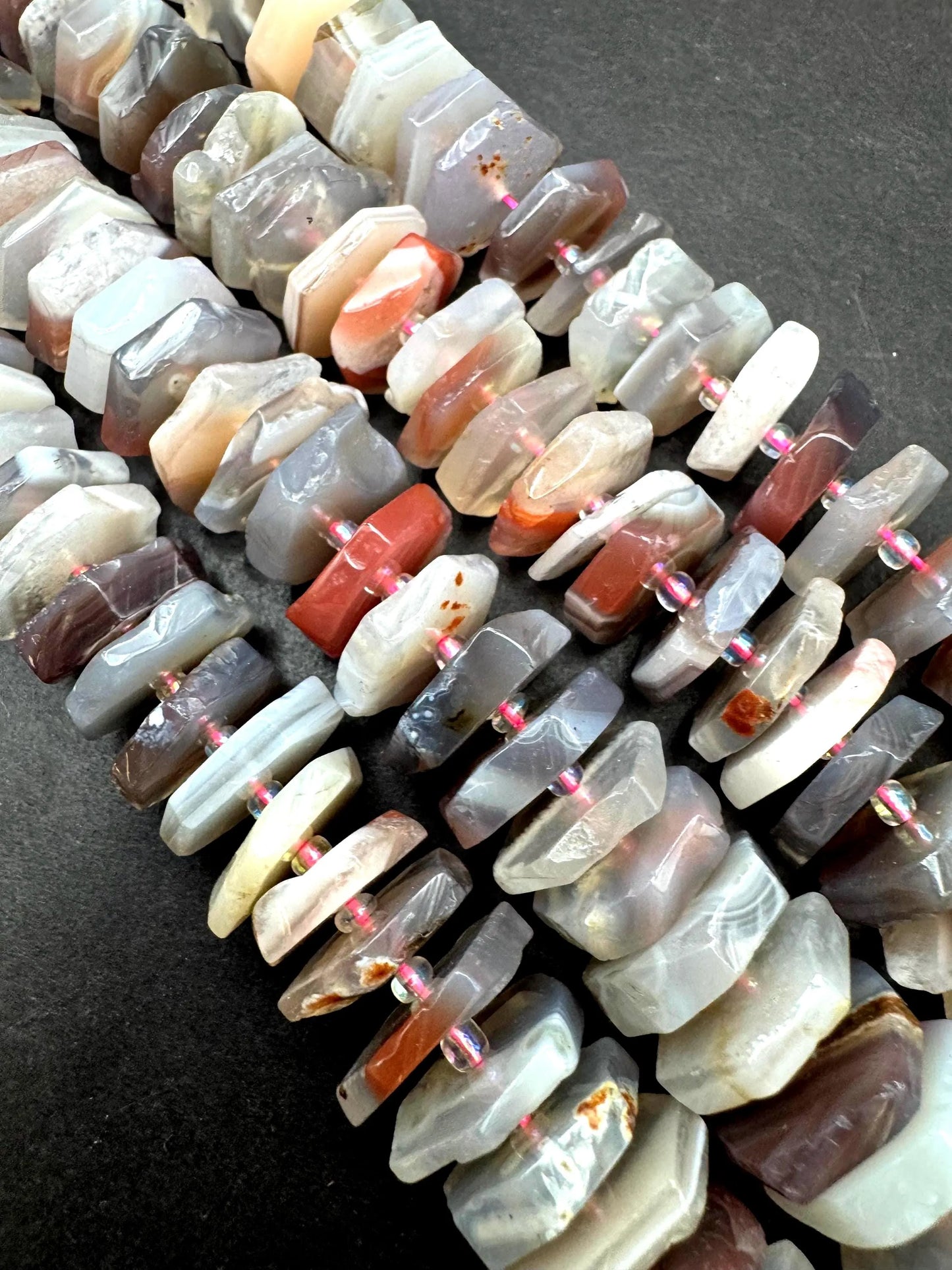 Natural Botswana gemstone bead. pinwheel shape . Gorgeous natural pink purple grayish color. Full strand 15.5”