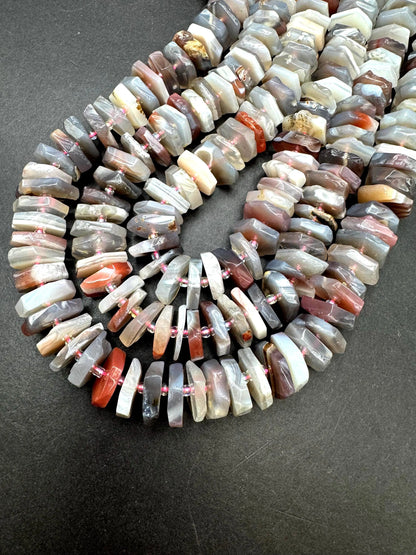 Natural Botswana gemstone bead. pinwheel shape . Gorgeous natural pink purple grayish color. Full strand 15.5”