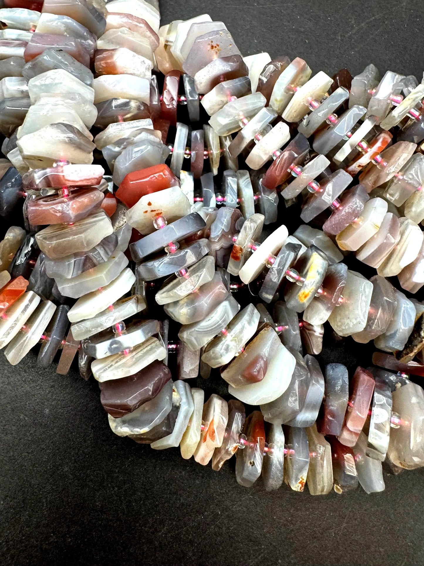 Natural Botswana gemstone bead. pinwheel shape . Gorgeous natural pink purple grayish color. Full strand 15.5”