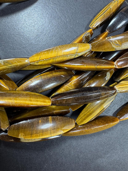 Natural tiger eye gemstone bead. Large oval shape . Natural brown yellow color. Full strand 15.5