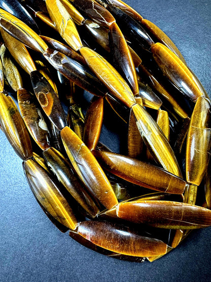 Natural tiger eye gemstone bead. Large oval shape . Natural brown yellow color. Full strand 15.5