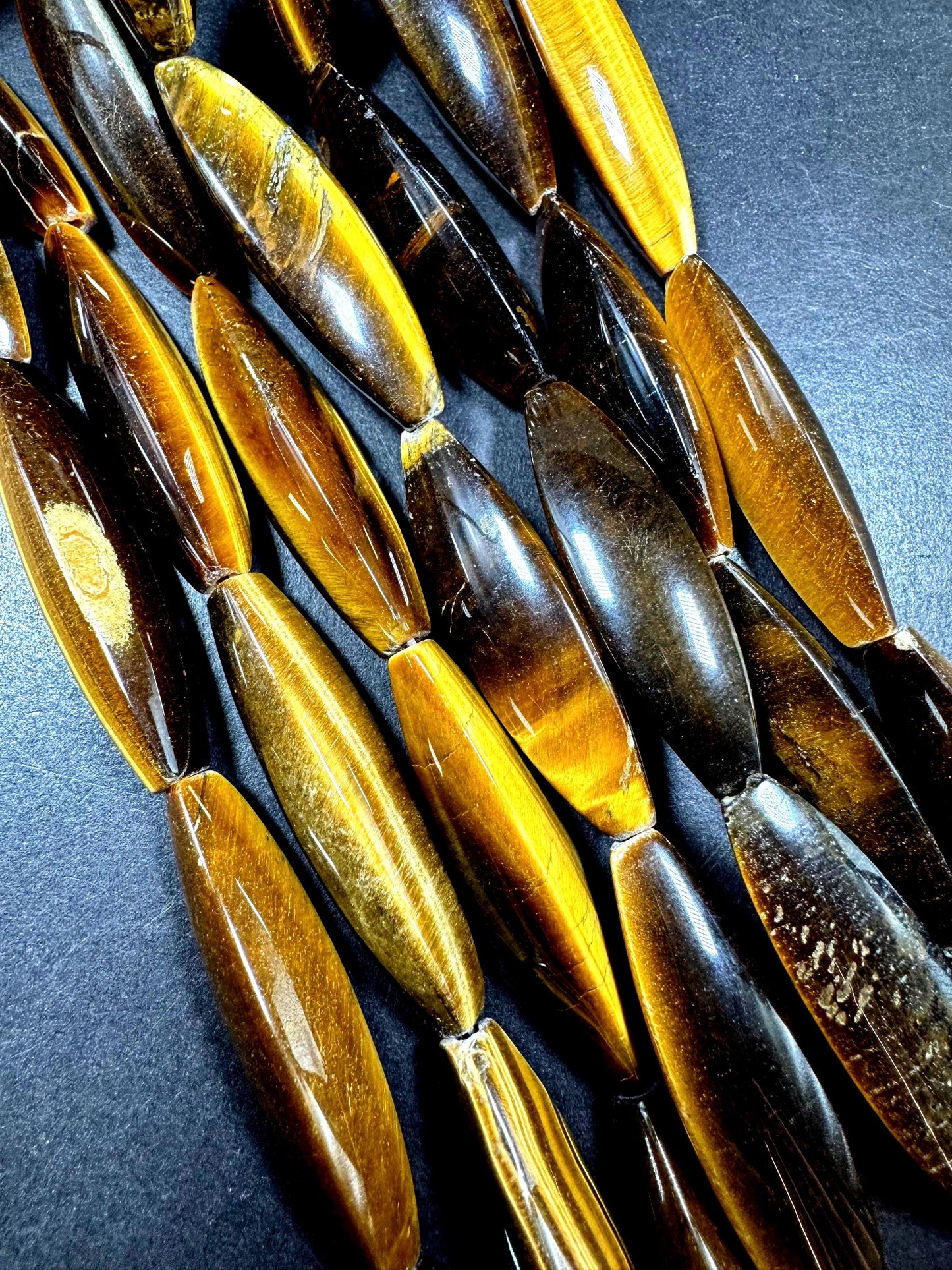 Natural tiger eye gemstone bead. Large oval shape . Natural brown yellow color. Full strand 15.5