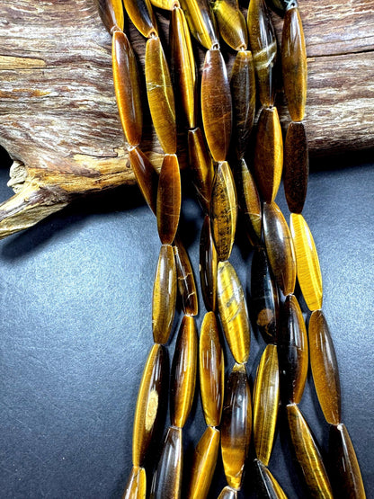 Natural tiger eye gemstone bead. Large oval shape . Natural brown yellow color. Full strand 15.5