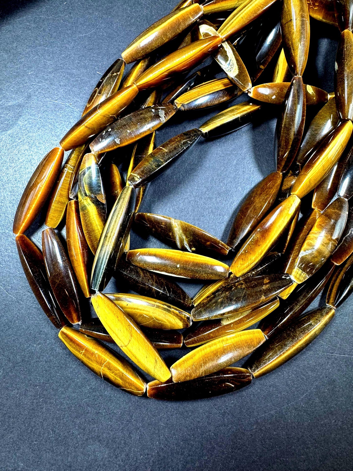 Natural tiger eye gemstone bead. Large oval shape . Natural brown yellow color. Full strand 15.5