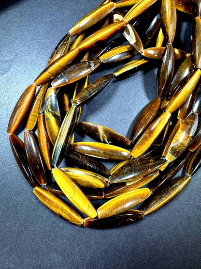 Natural tiger eye gemstone bead. Large oval shape . Natural brown yellow color. Full strand 15.5