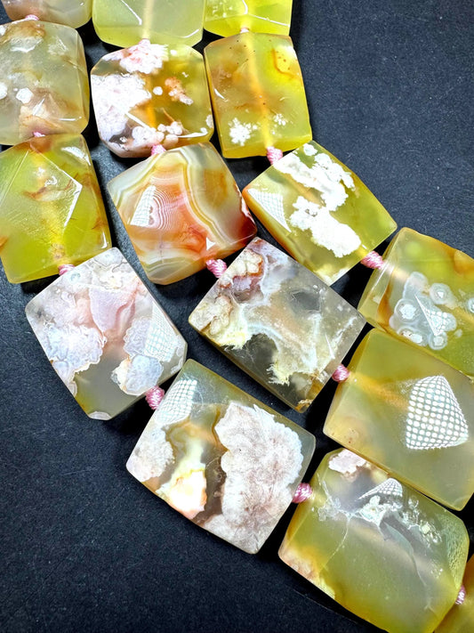 Natural cherry blossoms agate gemstone bead. Gorgeous natural pinkish color. Not treated. Excellent quality . Full strand 15.5