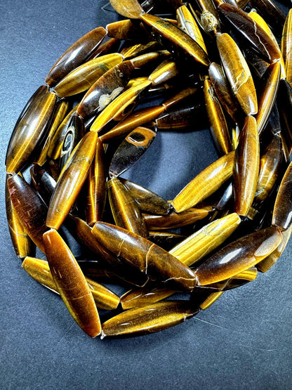 Natural tiger eye gemstone bead. Large oval shape . Natural brown yellow color. Full strand 15.5
