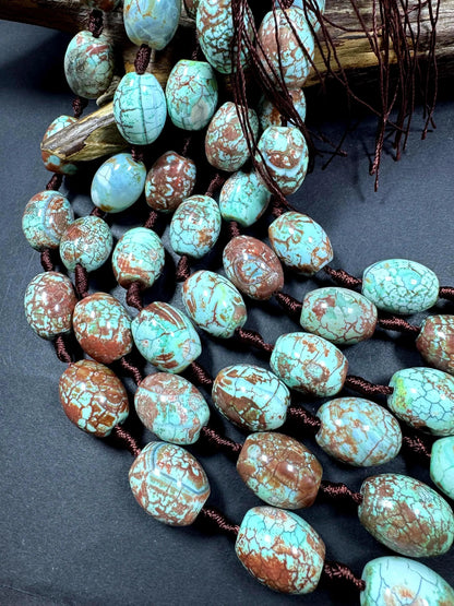 Natural Tibetan gemstone bead. barrel shape . gorgeous turquoise blue color with brown. excellent quality. full strand 15.5”