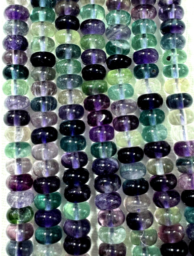 Natural fluorite gemstone beads. Rondelle shape . Gorgeous natural color. Not treated. Excellent quality. Full strand 15.5”