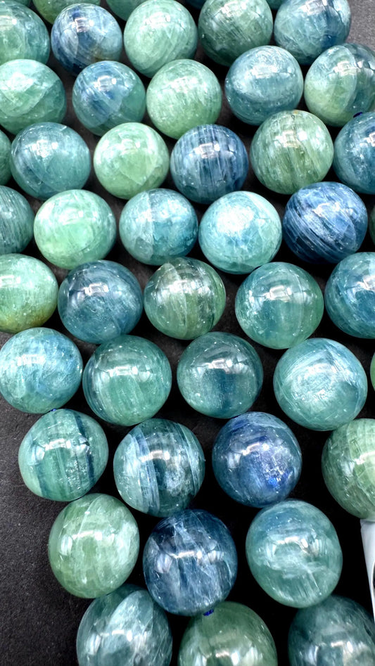 AAA Natural green kyanite gemstone bead. Smooth round bead. Gorgeous Natural green blue color . Excellent quality. Full strand 15.5”