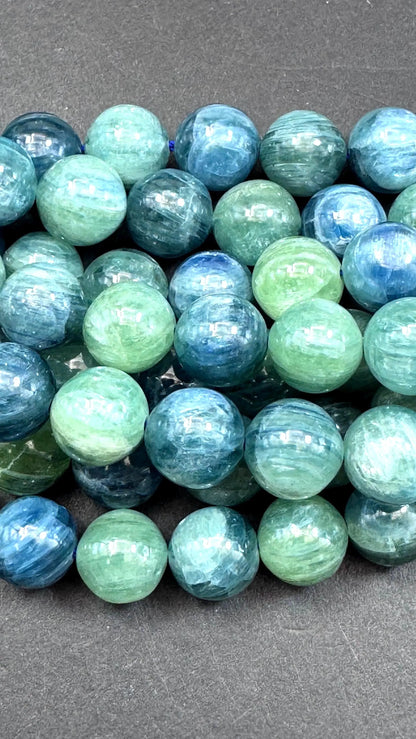 AAA Natural green kyanite gemstone bead. Smooth round bead. Gorgeous Natural green blue color . Excellent quality. Full strand 15.5”