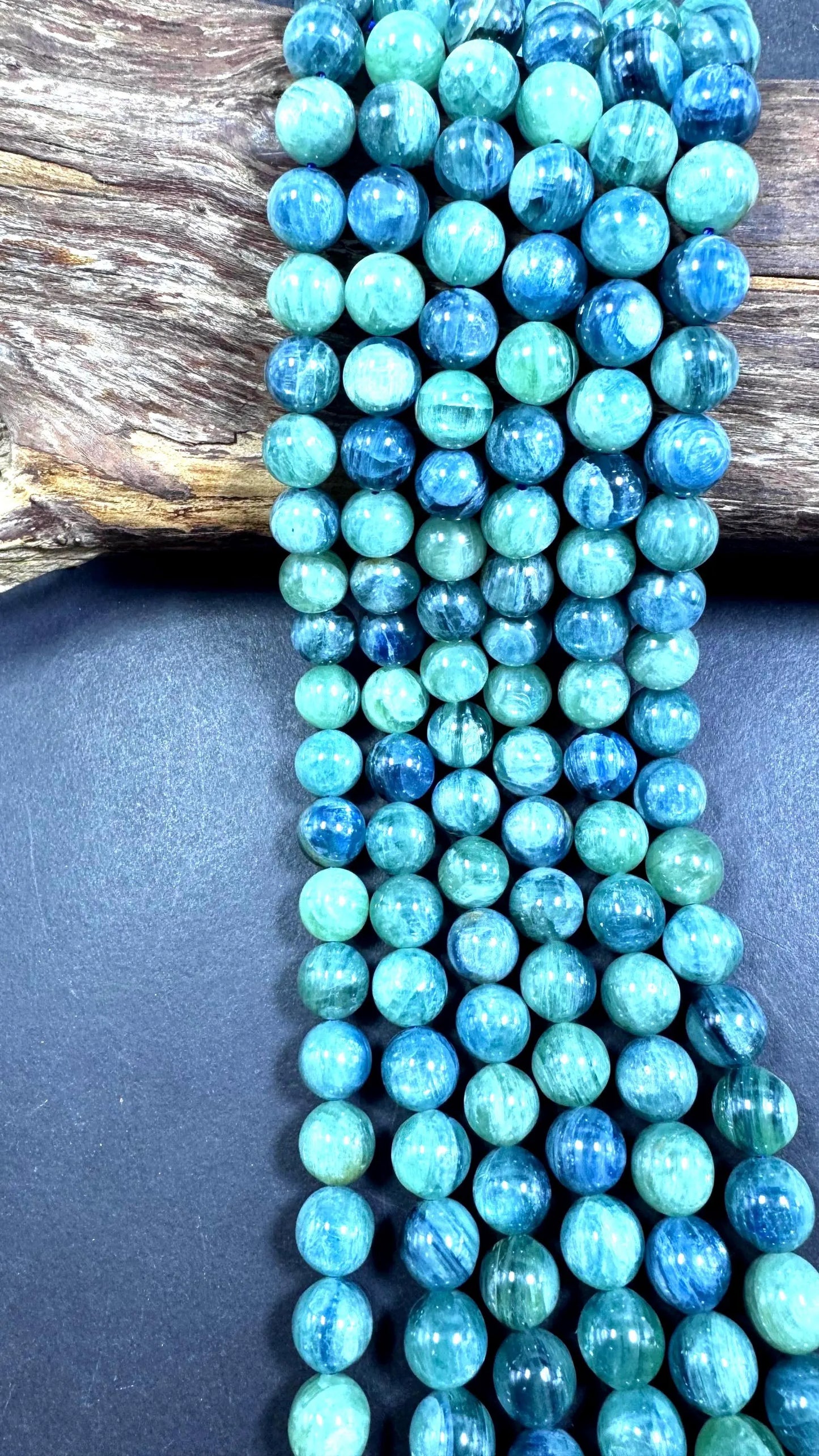 AAA Natural green kyanite gemstone bead. Smooth round bead. Gorgeous Natural green blue color . Excellent quality. Full strand 15.5”
