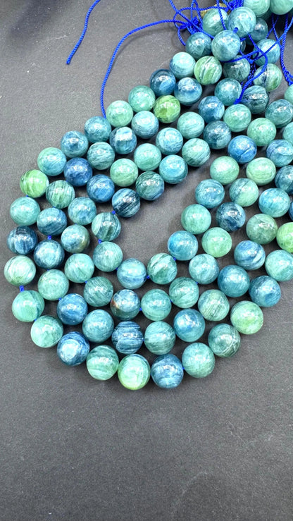 AAA Natural green kyanite gemstone bead. Smooth round bead. Gorgeous Natural green blue color . Excellent quality. Full strand 15.5”