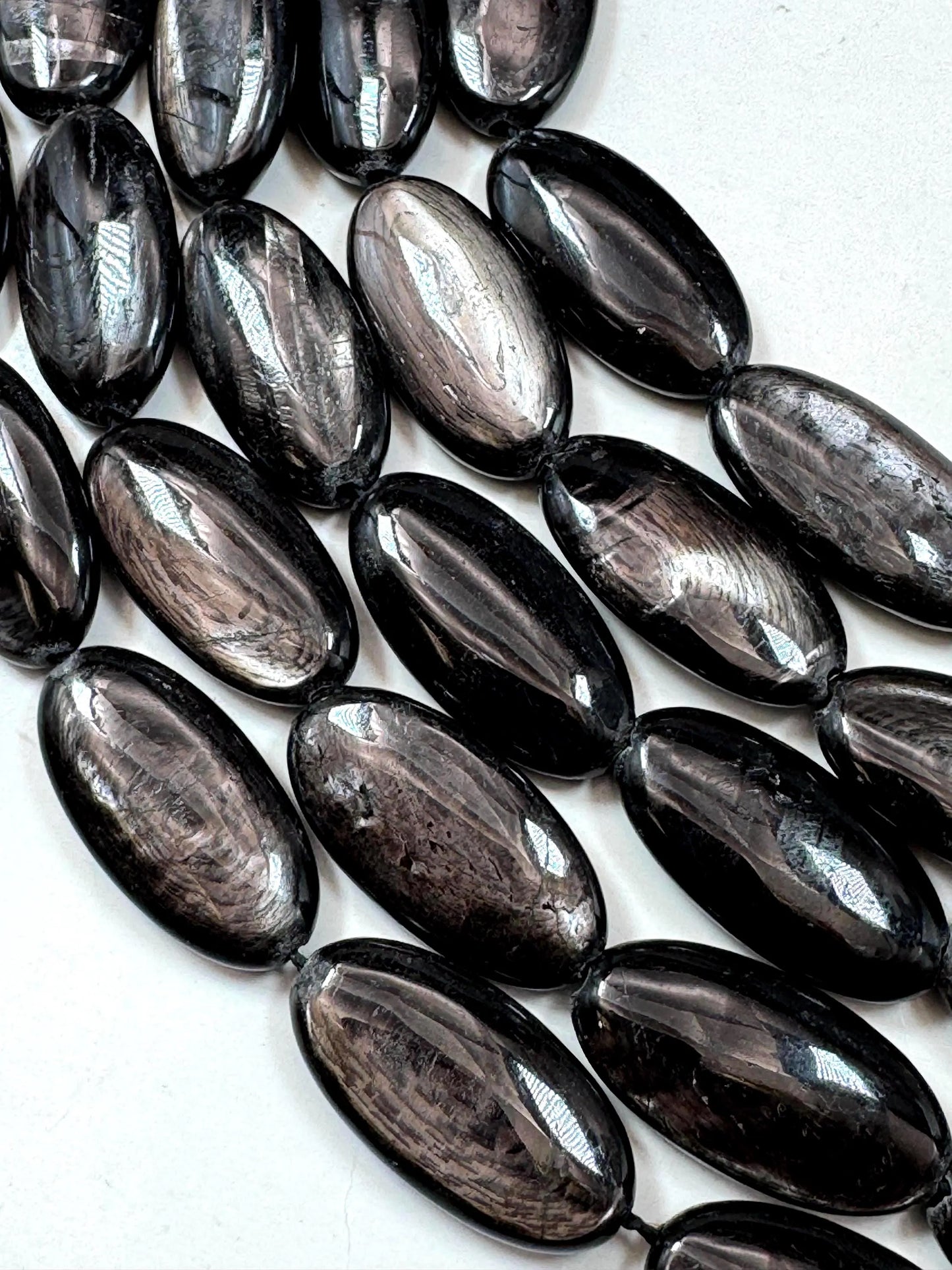 Natural Hypersthene Gemstone Beads: Black Oval Shape Rainbow Flash, 15.5" Strand