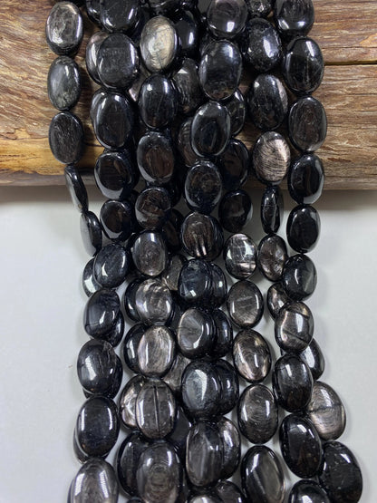 Natural Hypersthene Gemstone Beads: Black Oval Shape Rainbow Flash, 15.5" Strand