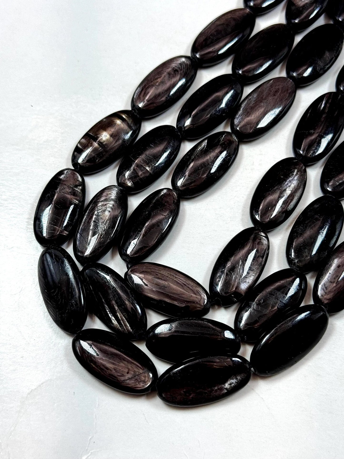 Natural Hypersthene Gemstone Beads: Black Oval Shape Rainbow Flash, 15.5" Strand