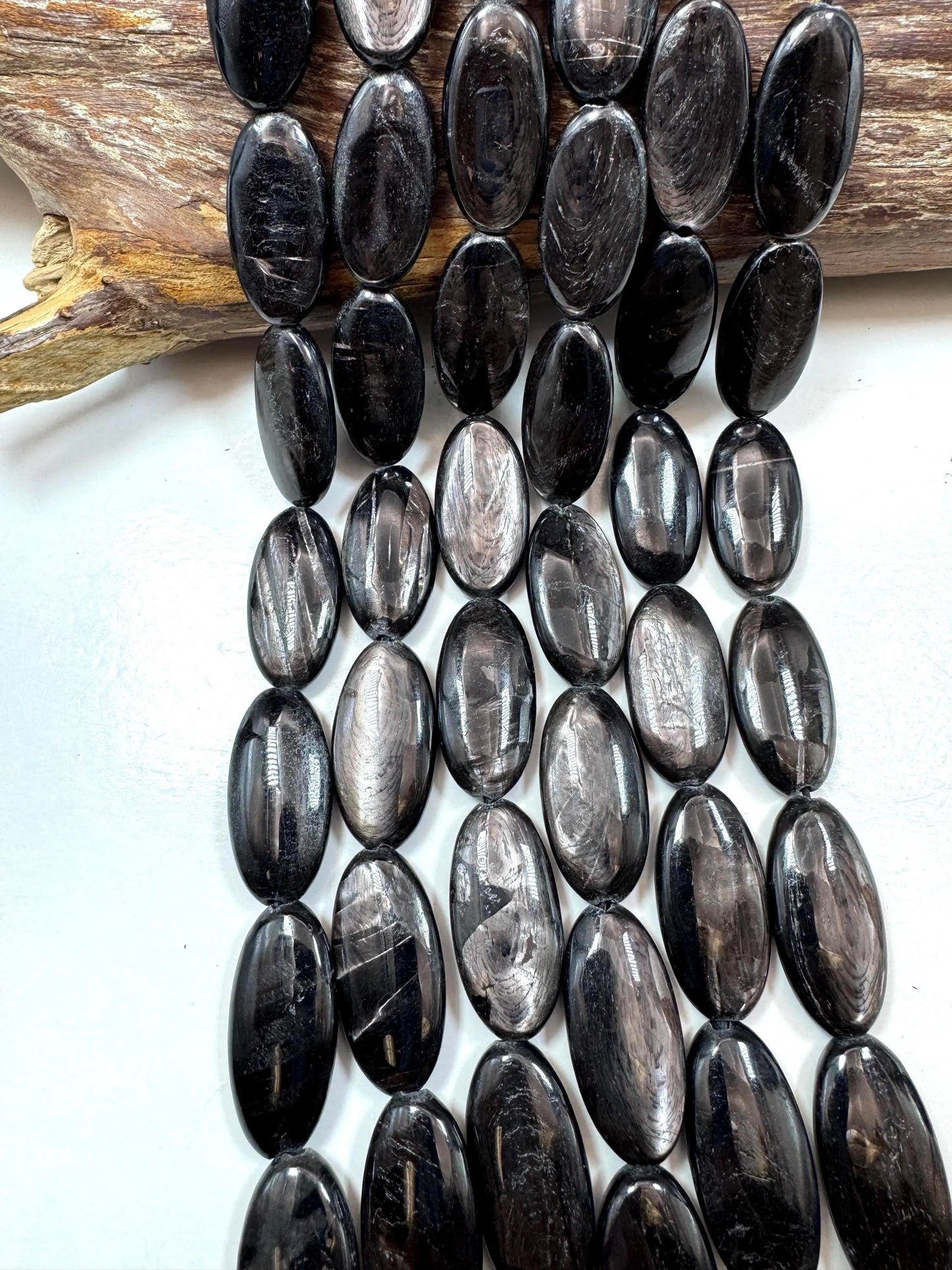 Natural Hypersthene Gemstone Beads: Black Oval Shape Rainbow Flash, 15.5" Strand